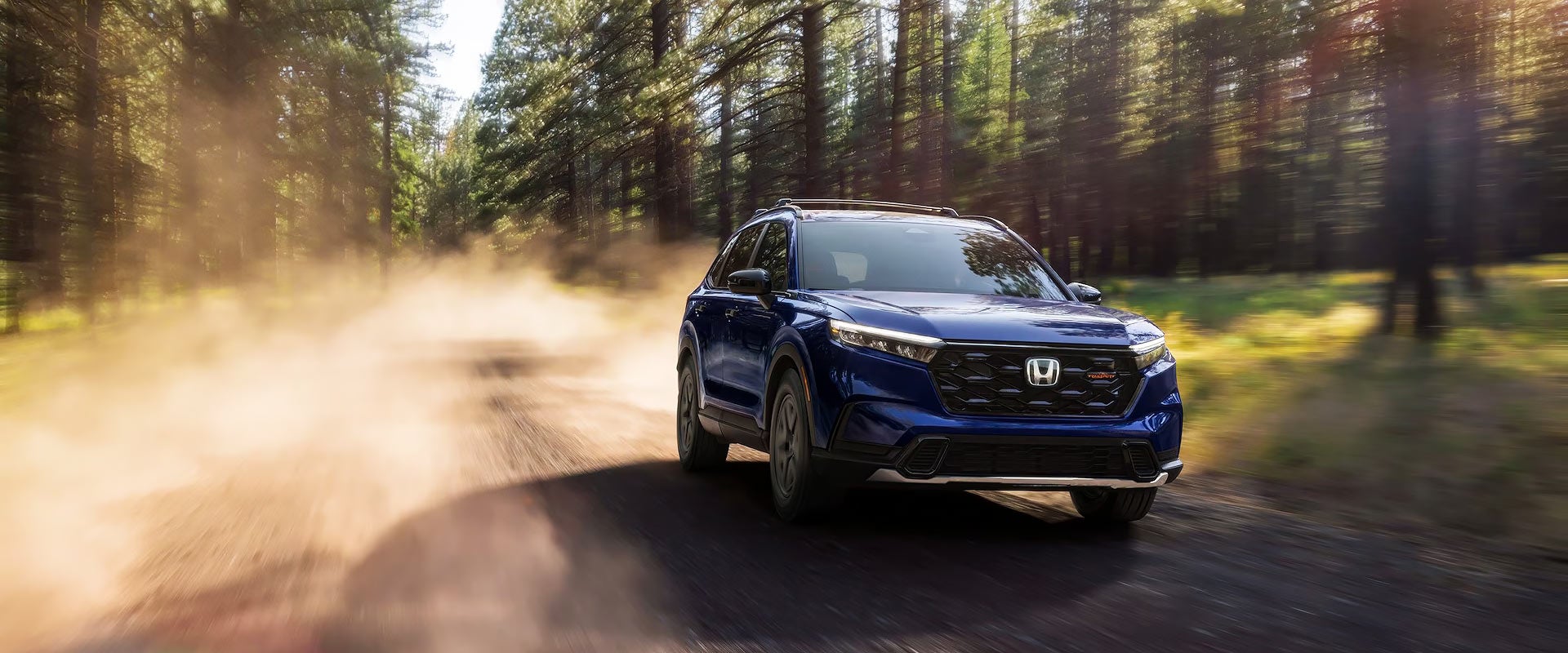 Honda front view driving on a dirt road